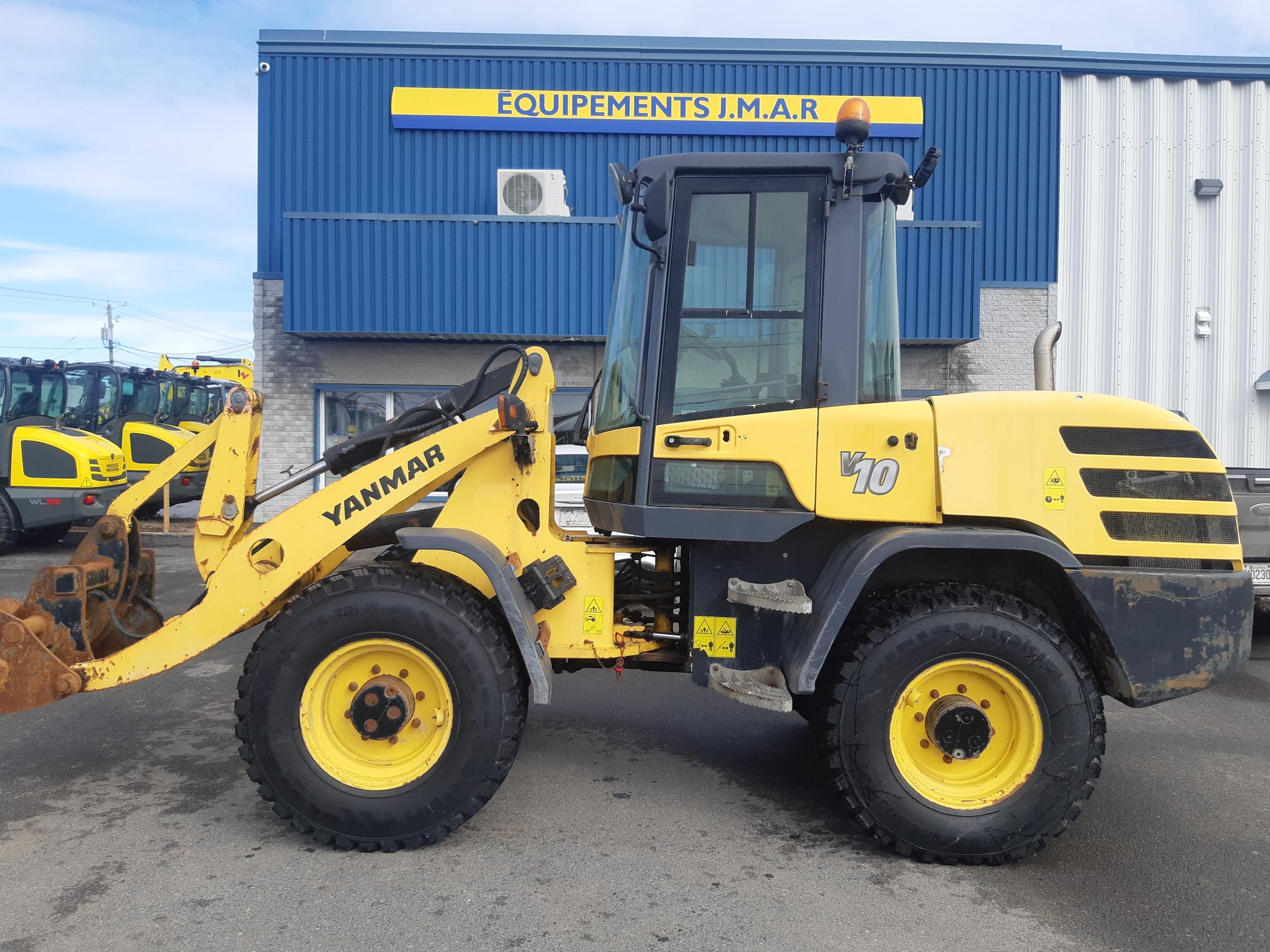 A yellow and black construction vehicle with 