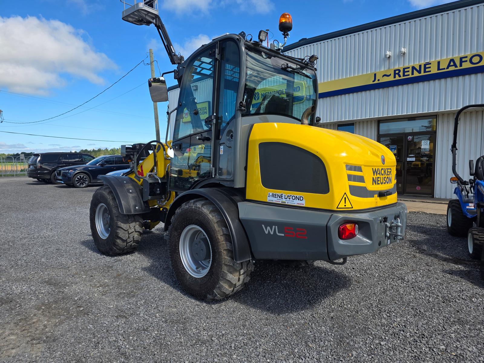Wacker Neuson WL52, intérieur de la cabine, siège protégé d'une housse plastique